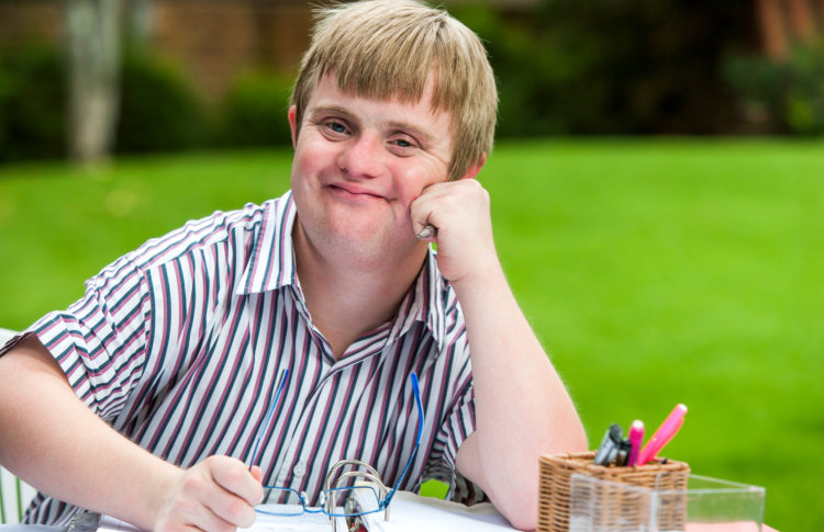 Boy with special needs studying outdoor