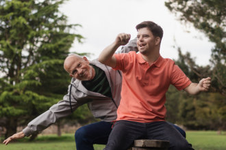 Father and his son posing in front of the camera