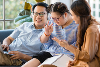 father and mother with their child sitting