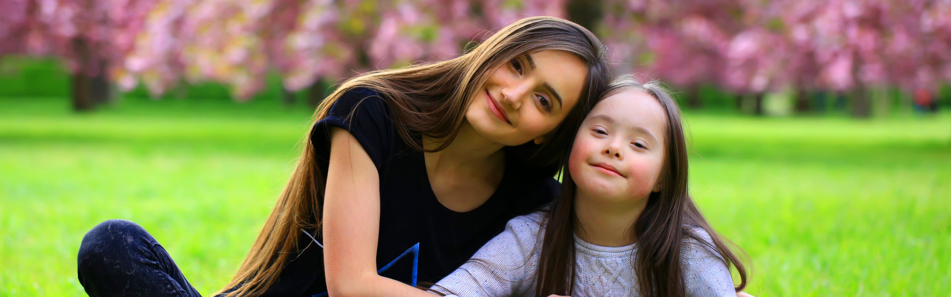 woman with kid sitting and smiling